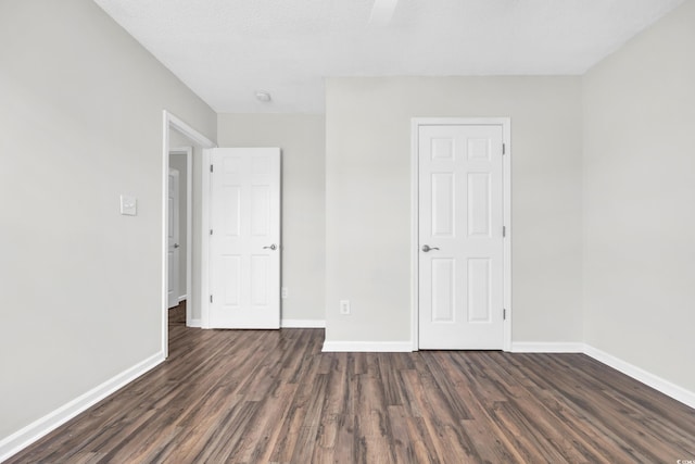 spare room featuring dark hardwood / wood-style floors