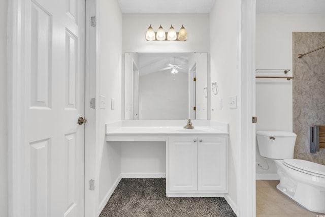 bathroom with toilet, ceiling fan, and vanity