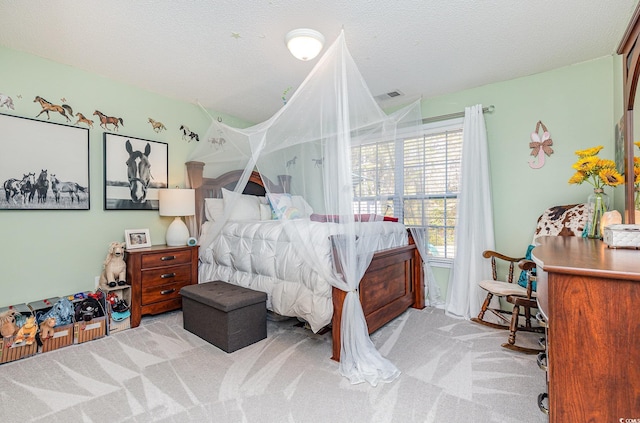 carpeted bedroom with a textured ceiling