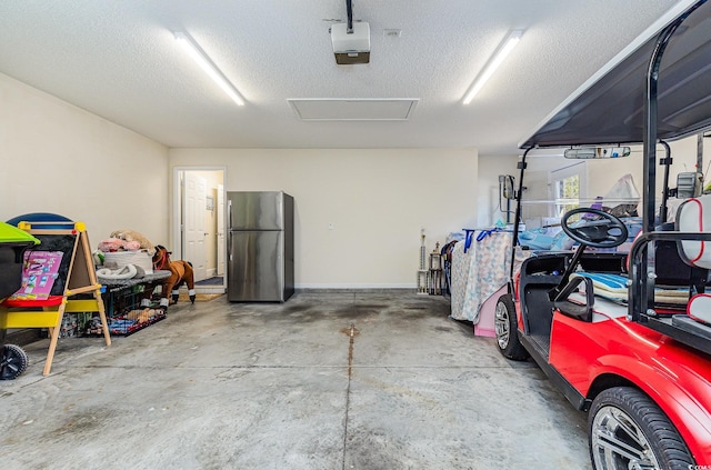 garage featuring stainless steel fridge and a garage door opener