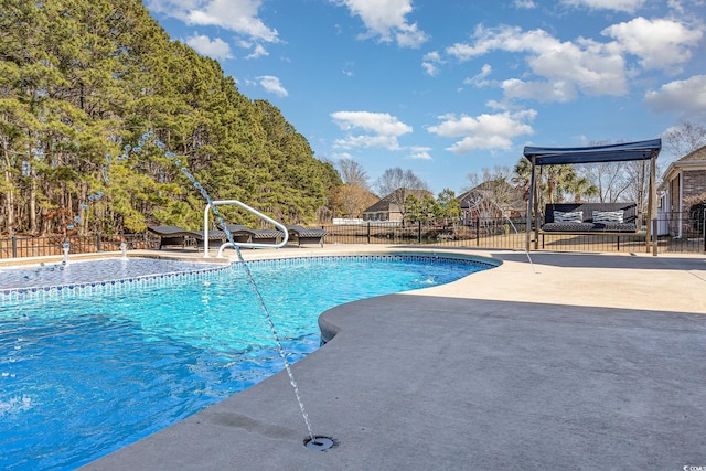 view of swimming pool with a patio area