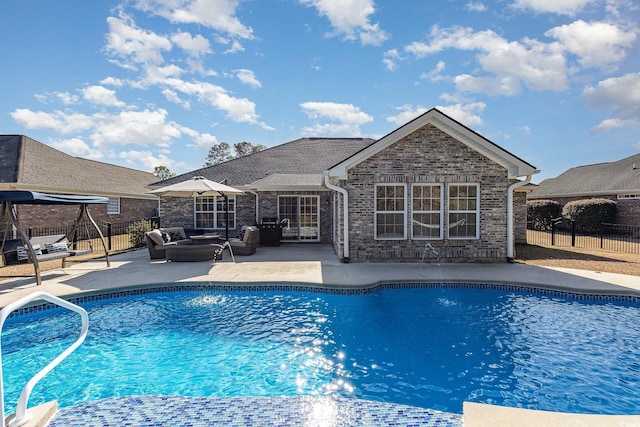 view of pool with a patio area and outdoor lounge area