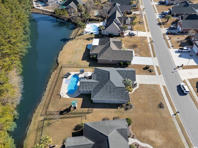 birds eye view of property featuring a water view