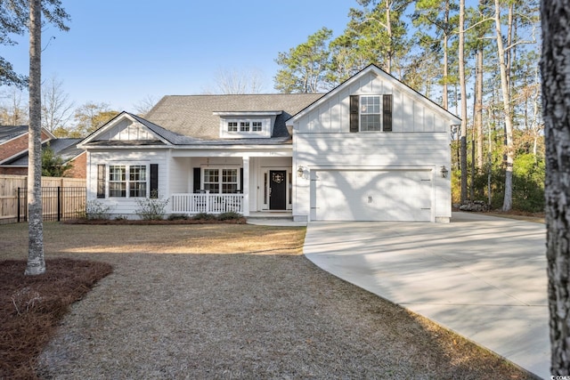 view of front facade featuring covered porch and a garage