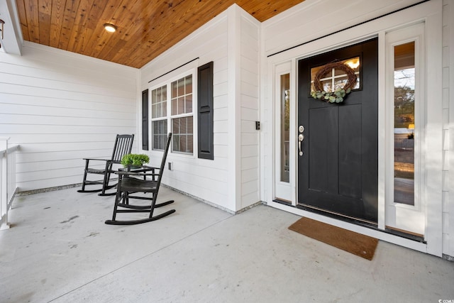 doorway to property featuring a porch