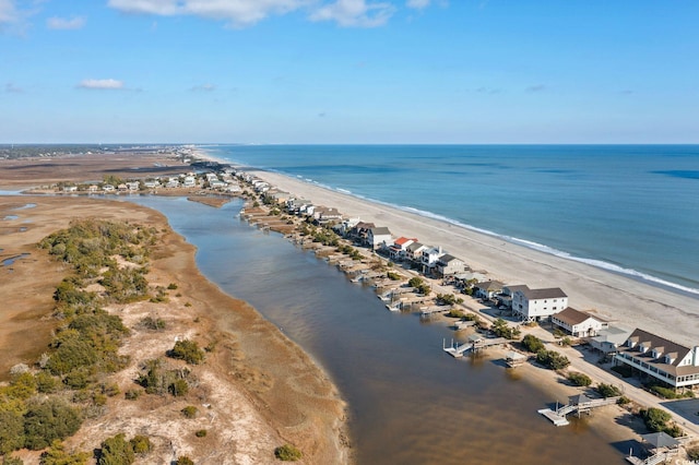 drone / aerial view with a water view and a view of the beach