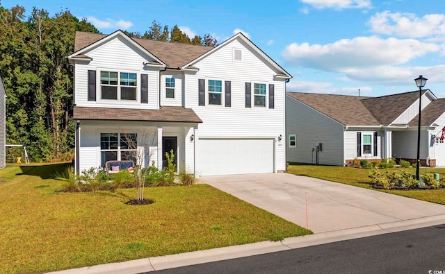 traditional home featuring a garage, a front yard, and driveway