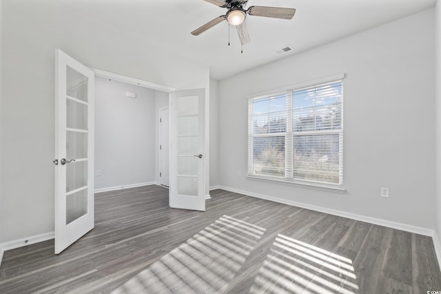 unfurnished bedroom with dark wood-type flooring, french doors, and ceiling fan