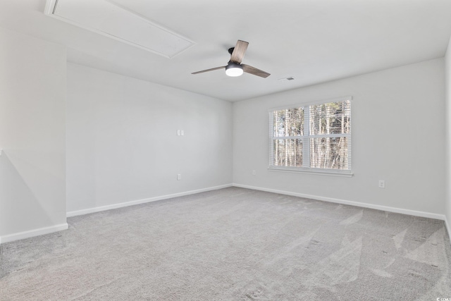 carpeted spare room with ceiling fan