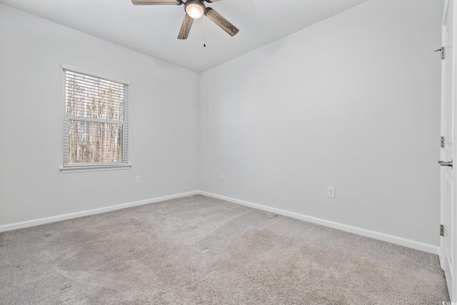 carpeted empty room with ceiling fan