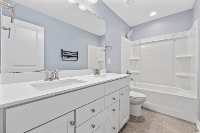 full bathroom with vanity, bathtub / shower combination, and toilet