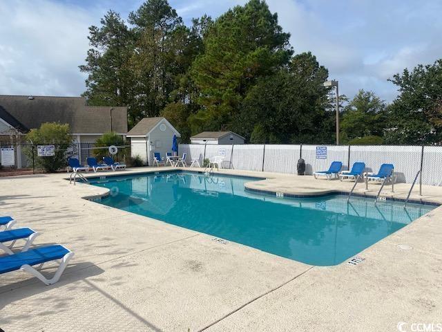 8650 Southbridge Dr Unit A, Surfside Beach, SC 29575 - community pool featuring a patio area