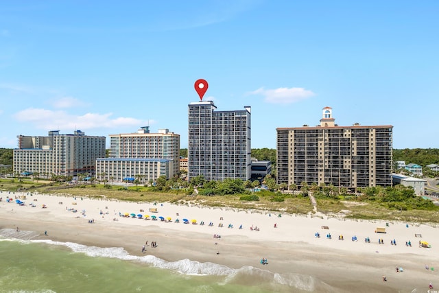 bird's eye view featuring a beach view and a water view