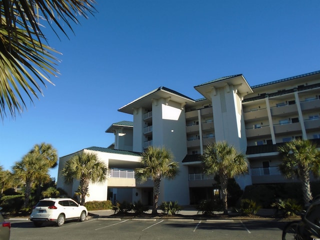 view of property with uncovered parking