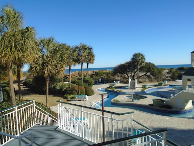 view of property's community with a patio and a swimming pool