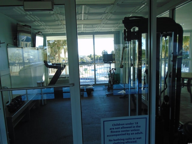 workout area featuring floor to ceiling windows