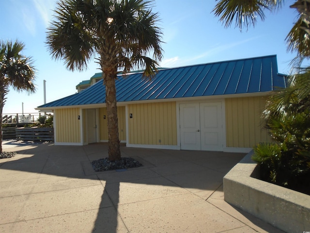 exterior space with a standing seam roof and metal roof