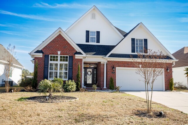 view of front property with a front yard and a garage