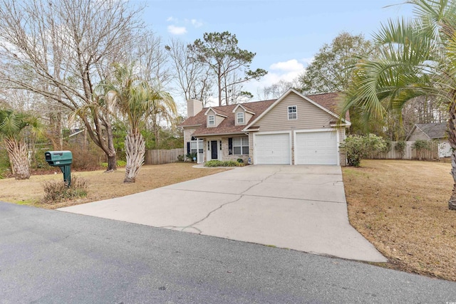 view of front of house with a garage and a front lawn