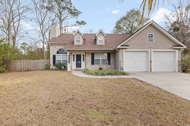 view of front of house featuring a front lawn and a garage