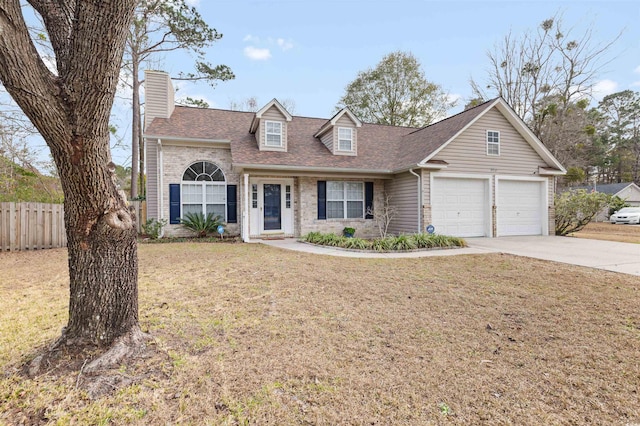 view of front of house featuring a front lawn and a garage