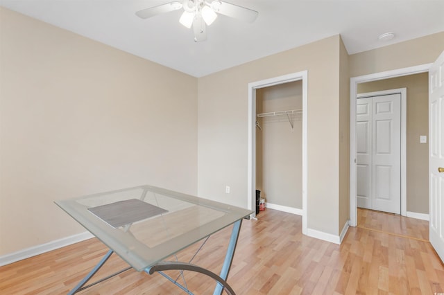 interior space with light hardwood / wood-style floors and ceiling fan