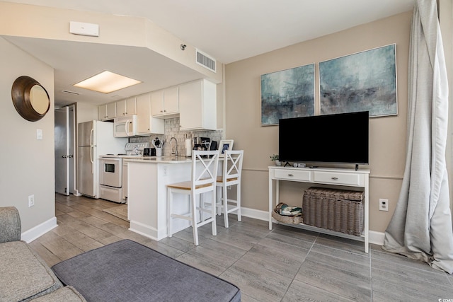 living room featuring sink