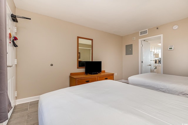 bedroom featuring white fridge