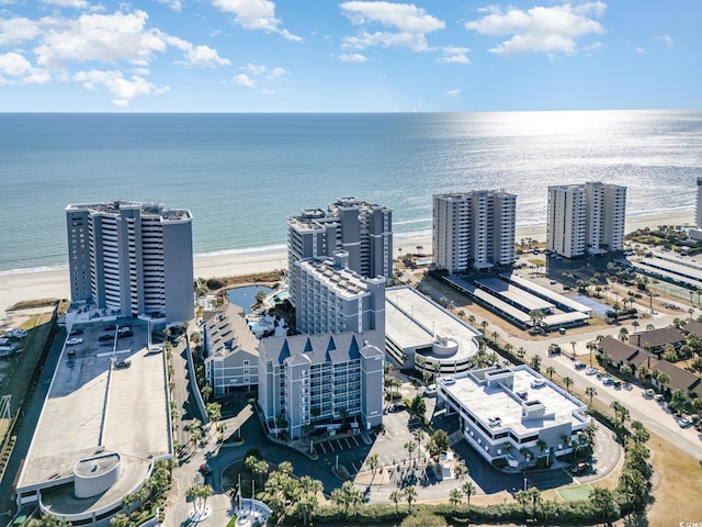 bird's eye view featuring a water view and a view of the beach