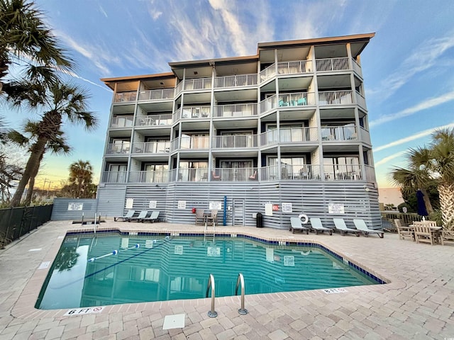 view of swimming pool featuring a patio area