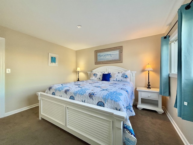 bedroom featuring dark carpet