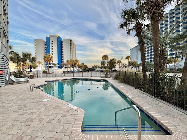 view of swimming pool with a patio area