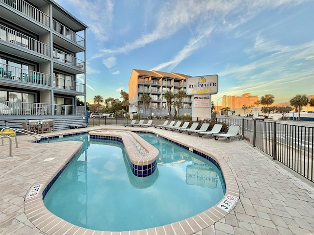 view of swimming pool with a patio