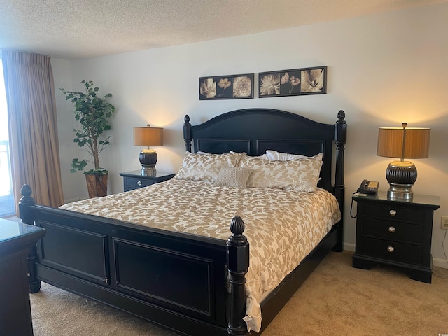 carpeted bedroom featuring a textured ceiling