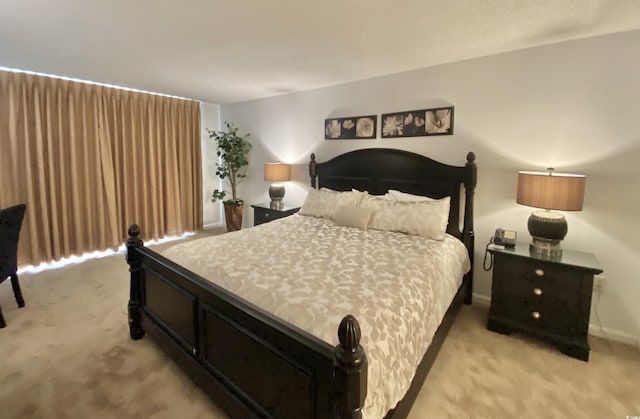 bedroom with light carpet