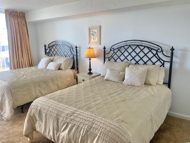 carpeted bedroom with a textured ceiling