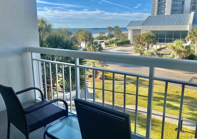 balcony featuring a water view