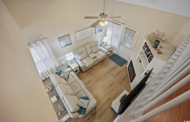 living room with ceiling fan and hardwood / wood-style floors