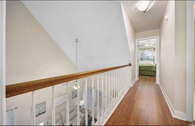 bathroom with hardwood / wood-style flooring and ornamental molding