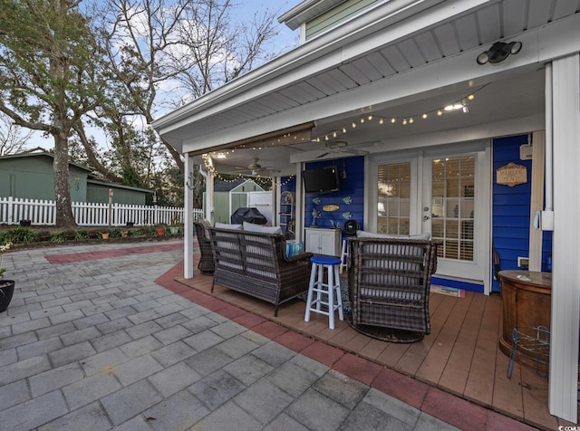 view of patio / terrace featuring an outdoor hangout area, ceiling fan, and french doors