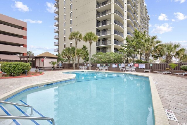 view of pool featuring a patio