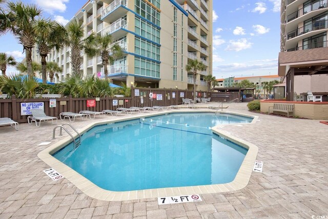 view of swimming pool with a patio