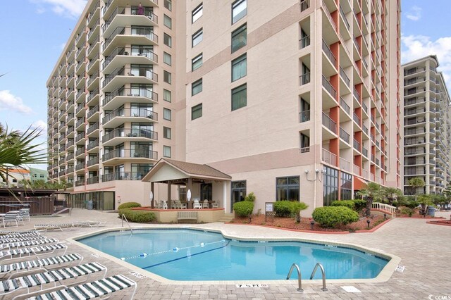 view of swimming pool featuring a gazebo and a patio