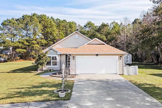 view of front of house with a garage and a front yard