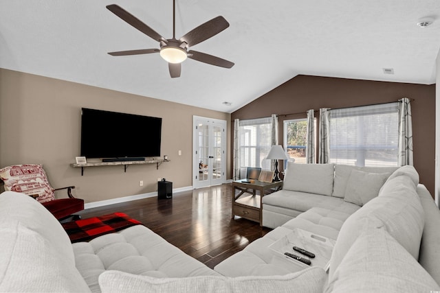 living room featuring ceiling fan, dark hardwood / wood-style flooring, lofted ceiling, and french doors