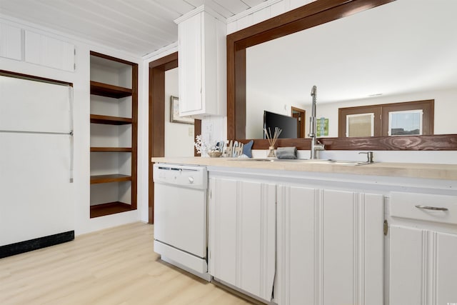 kitchen featuring white cabinetry, sink, white appliances, and light hardwood / wood-style flooring