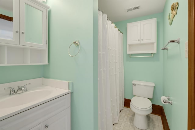 bathroom with toilet and vanity