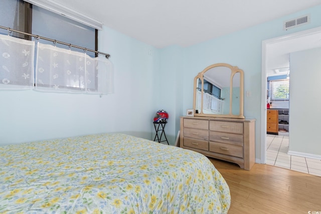 bedroom featuring light hardwood / wood-style floors