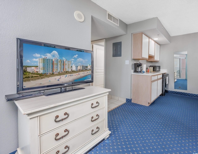 kitchen featuring dishwashing machine, carpet flooring, a textured ceiling, and electric panel