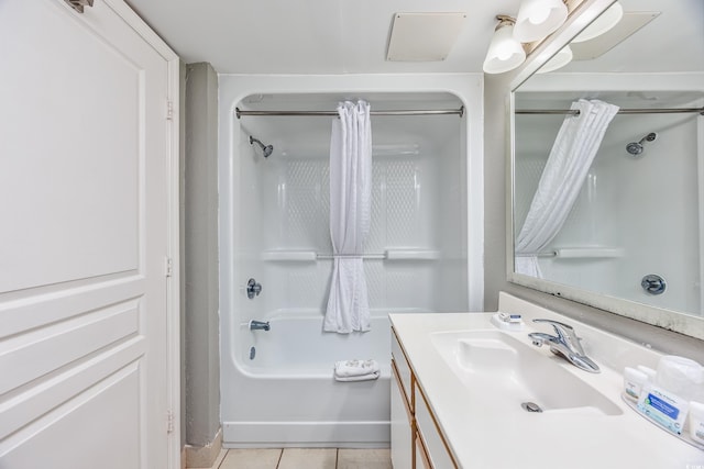 bathroom with vanity, shower / tub combo with curtain, and tile patterned flooring